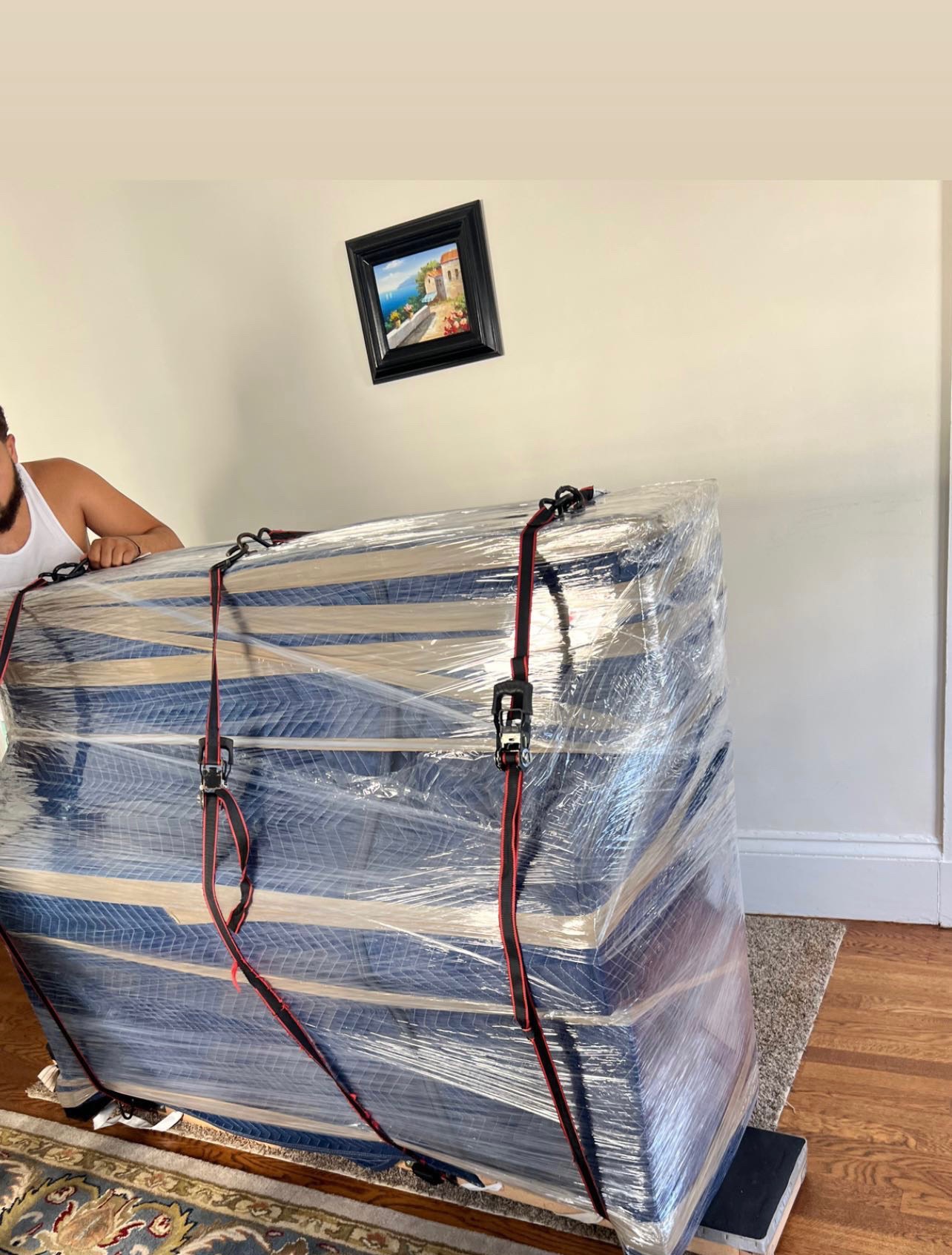 Furniture pad-wrapped and shrink-sealed
